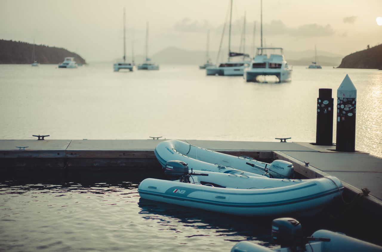 Dinghies tied up to a dock