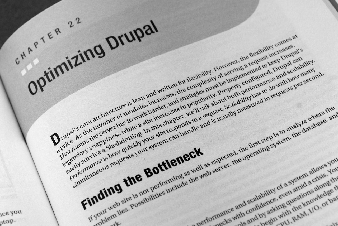 A book page from "Pro Drupal Development" showing Chapter 22 titled "Optimizing Drupal" with a section on performance.