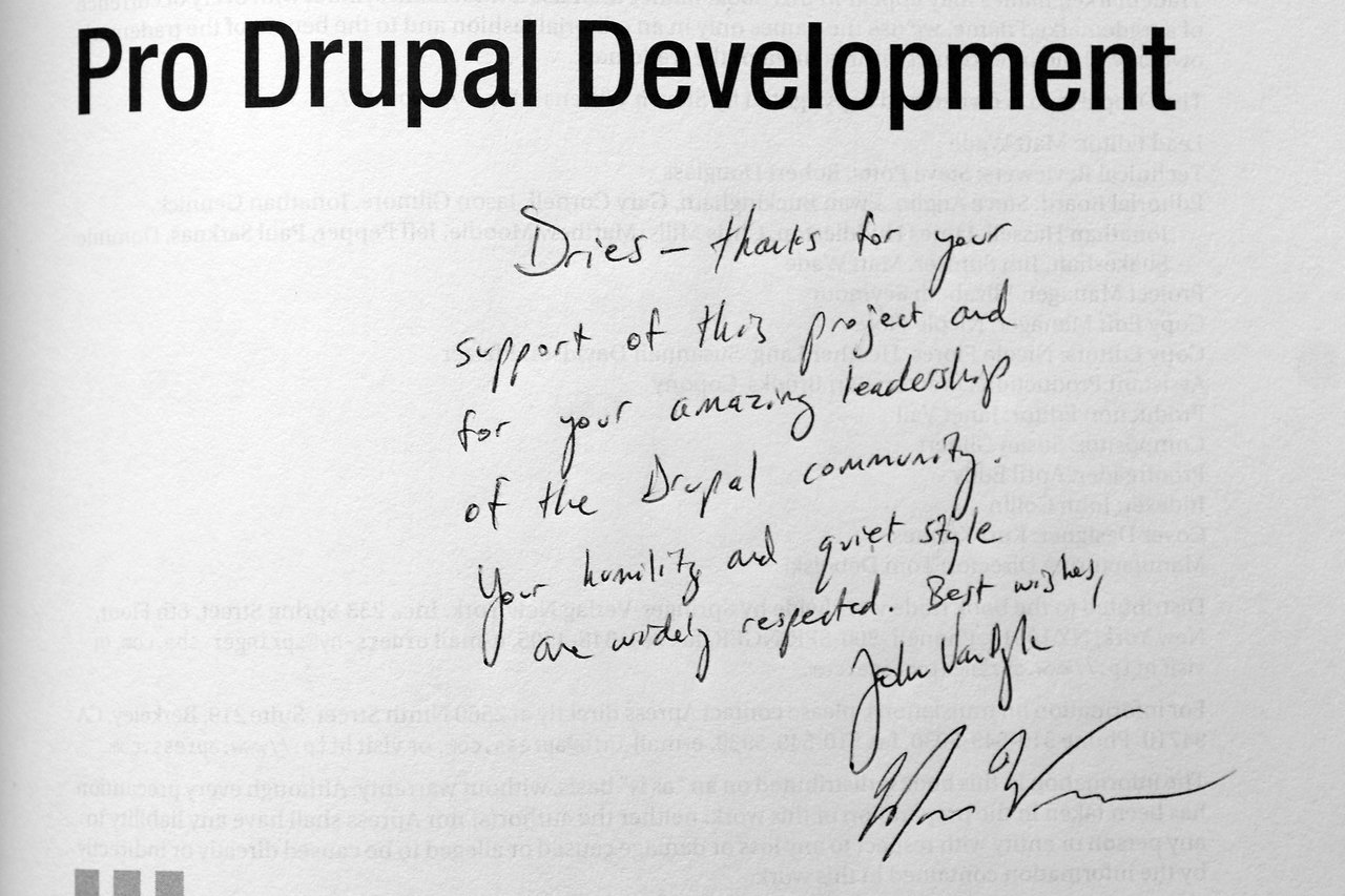 A handwritten note on the title page of "Pro Drupal Development" thanks Dries for leadership in the Drupal community.