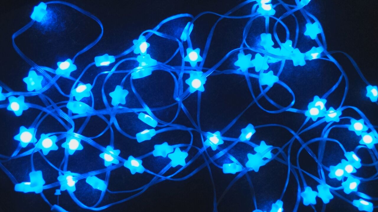 Blue LED string lights, glowing against a dark background