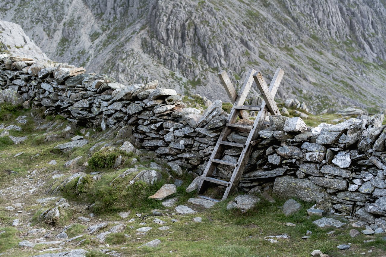 A stone wall with a step ladder