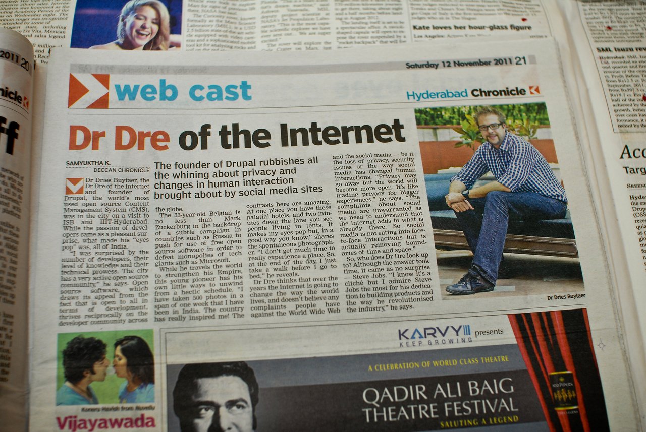 A newspaper article about Dries Buytaert, founder of Drupal, discussing privacy and social media, with his photo included.