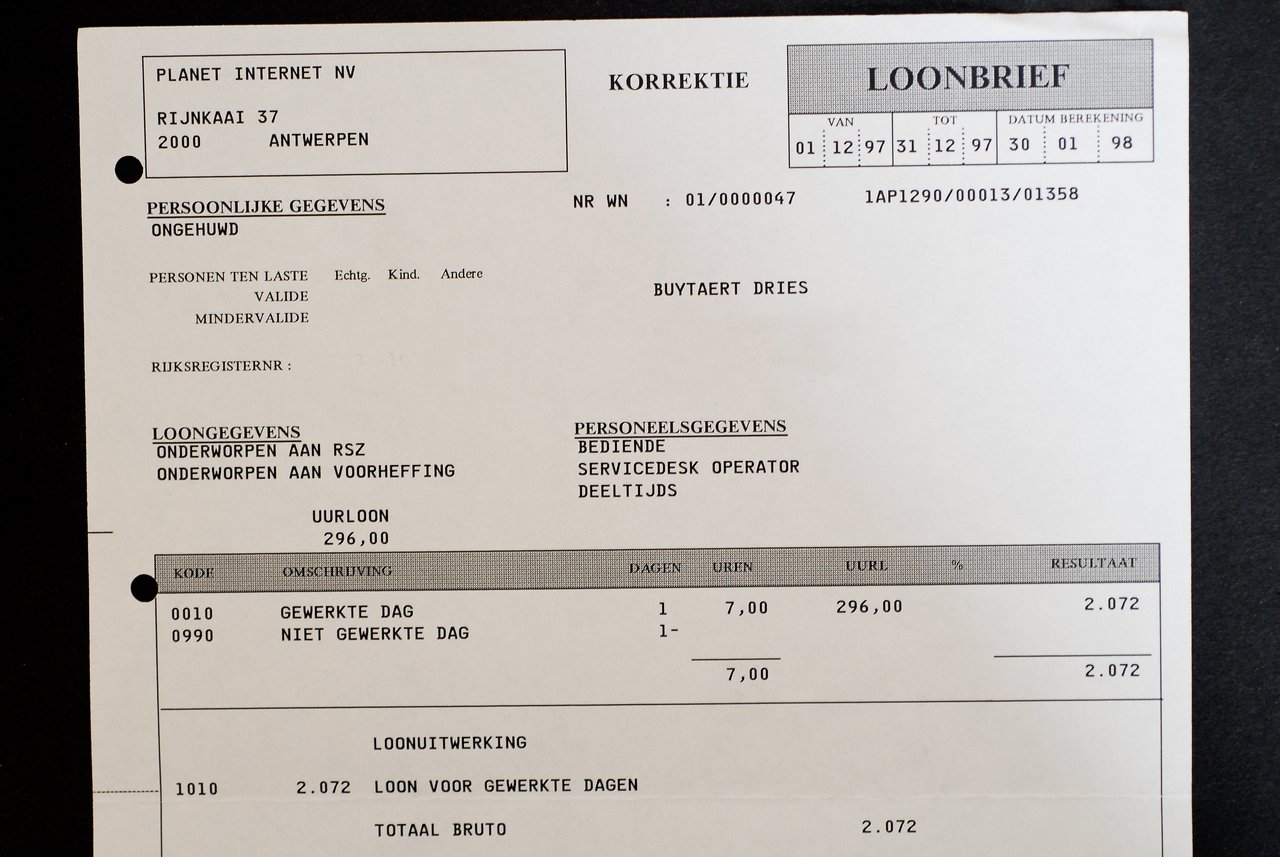 A printed payslip labeled "First Paycheck", showing earnings and deductions for December 1997 to January 1998.