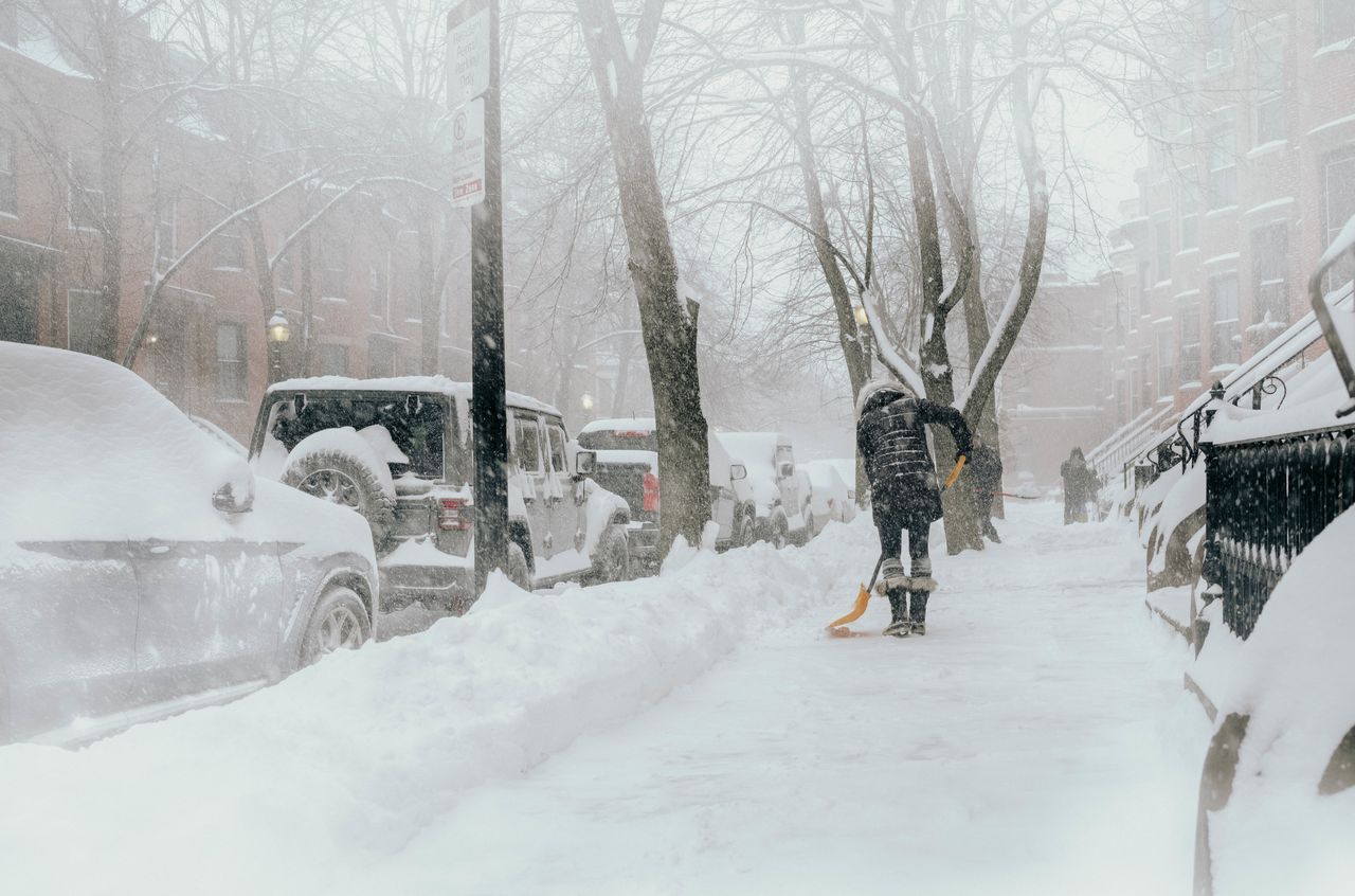 Snow shoveling A woman shoveling snow on a sidewalk.