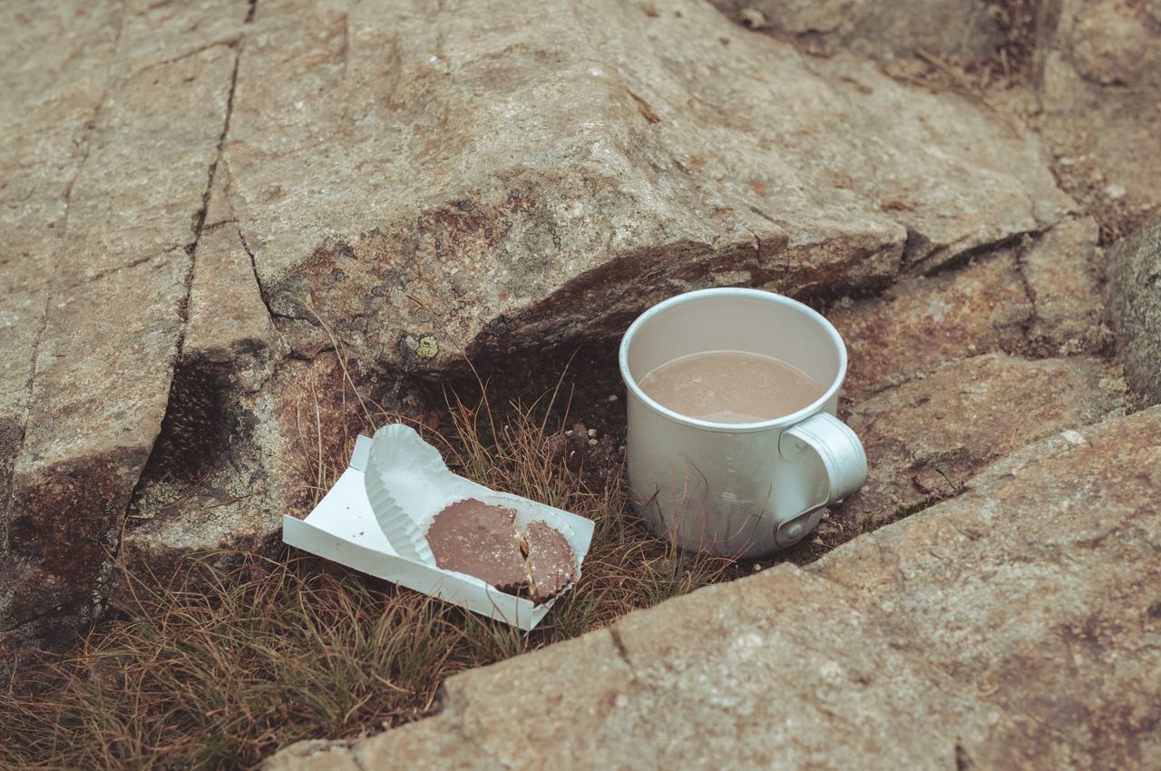 Peanut butter cup and electrolyte tablet A peanut butter cup next to a cup containing water with an electrolyte tablet.