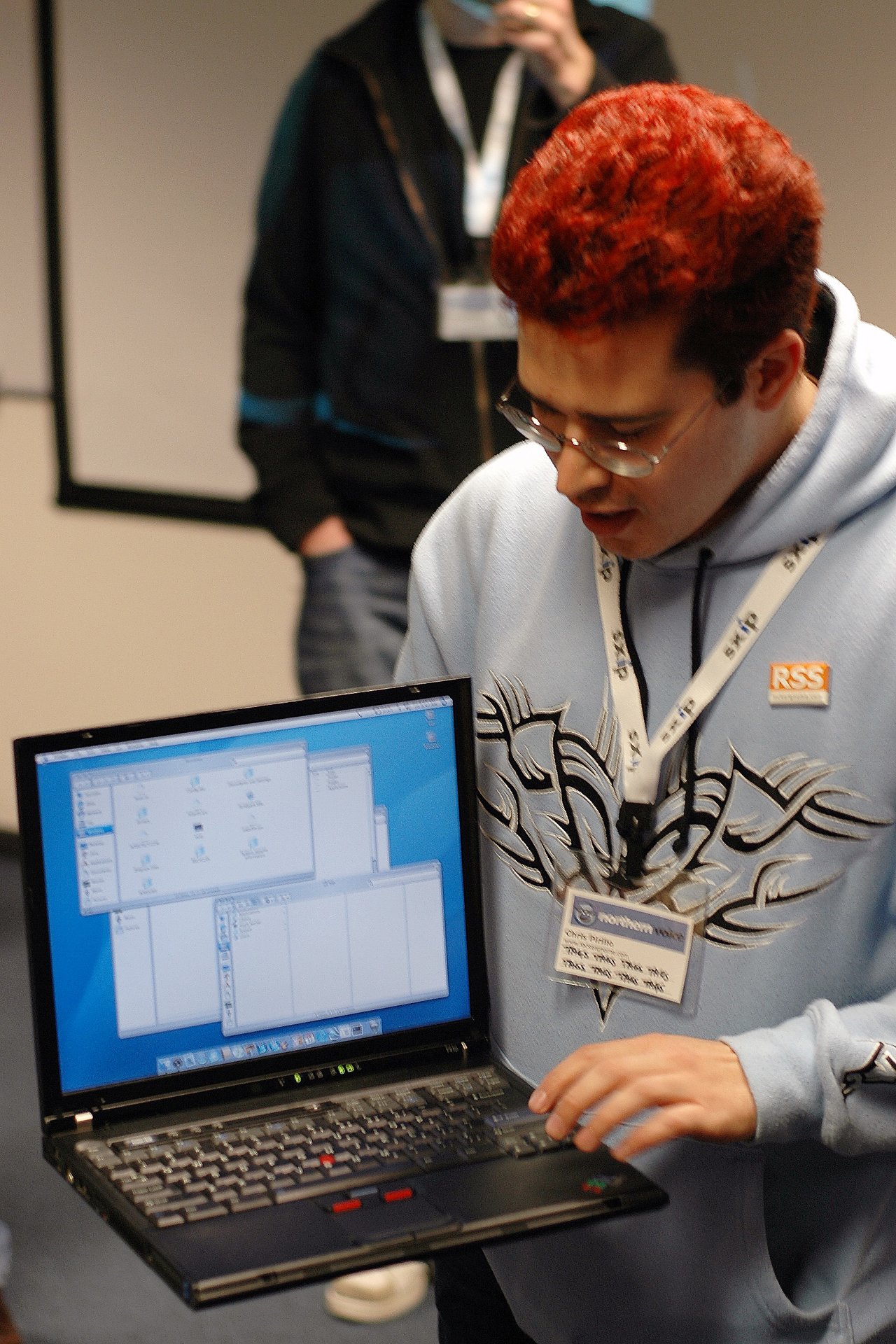 Chris Perillo showing his IBM Thinkpad running MacOS X