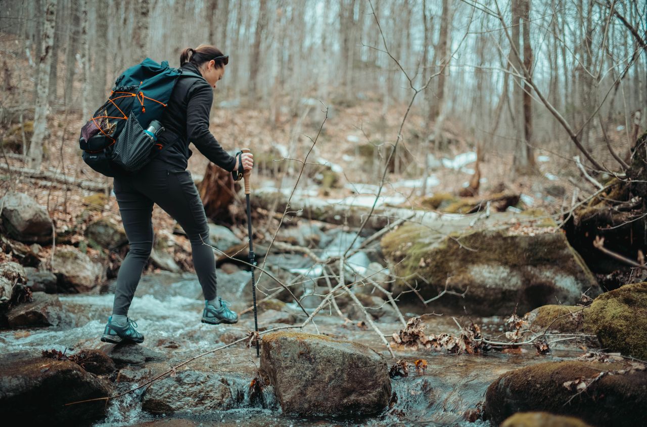 Vanessa crossing a stream by stepping from rock to rock