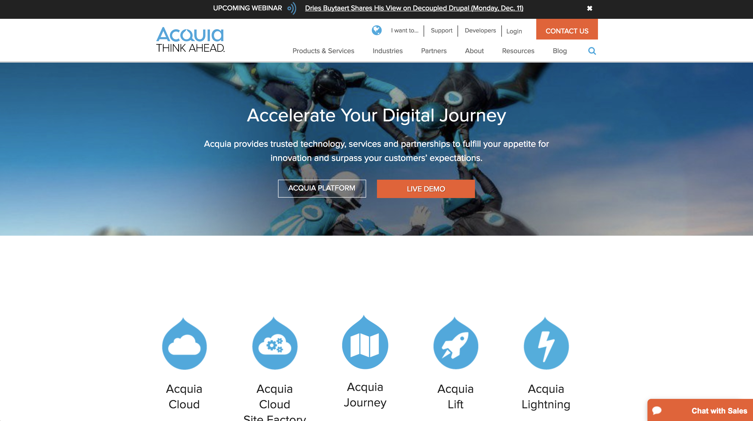Acquia website homepage with a banner of skydivers and buttons for Acquia Platform and Live Demo.