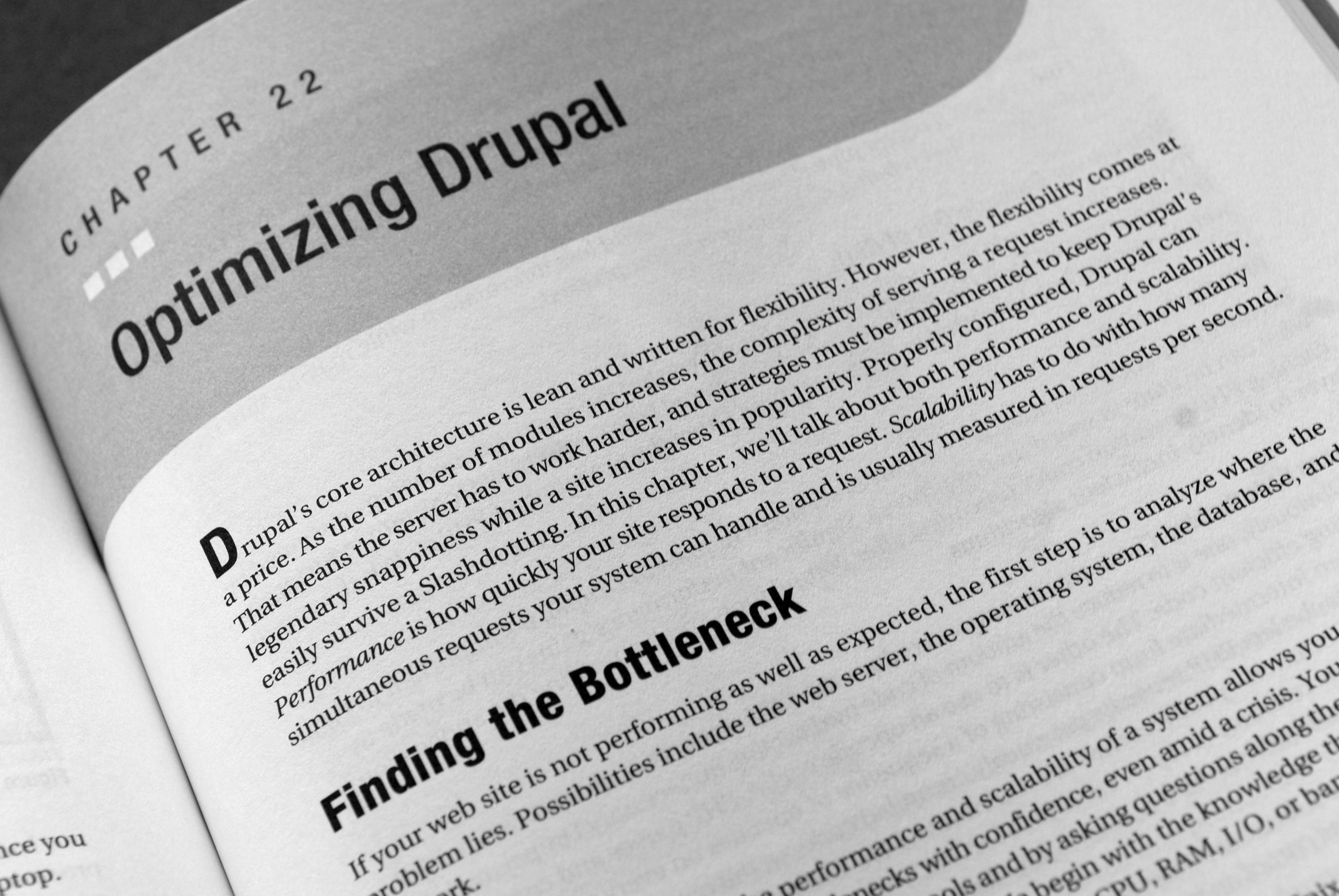 A book page from "Pro Drupal Development" showing Chapter 22 titled "Optimizing Drupal" with a section on performance.