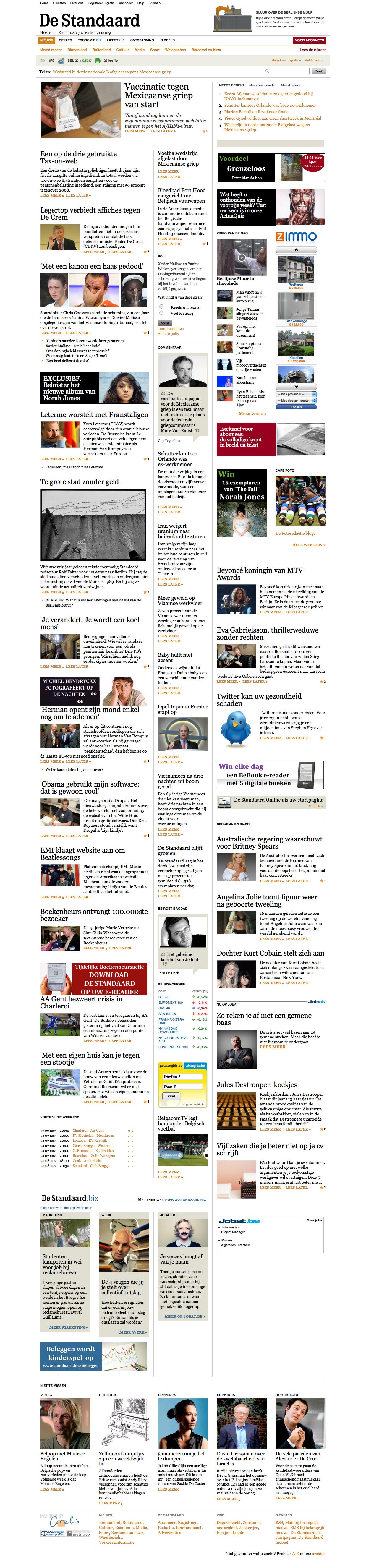 A news website front page with multiple headlines, images, and articles arranged in columns.