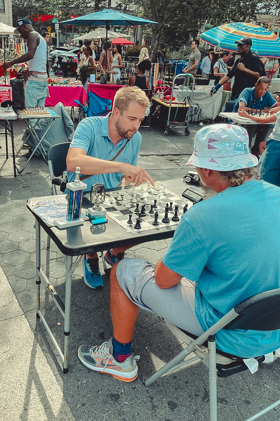 wo men playing chess at an outdoor market in New York City