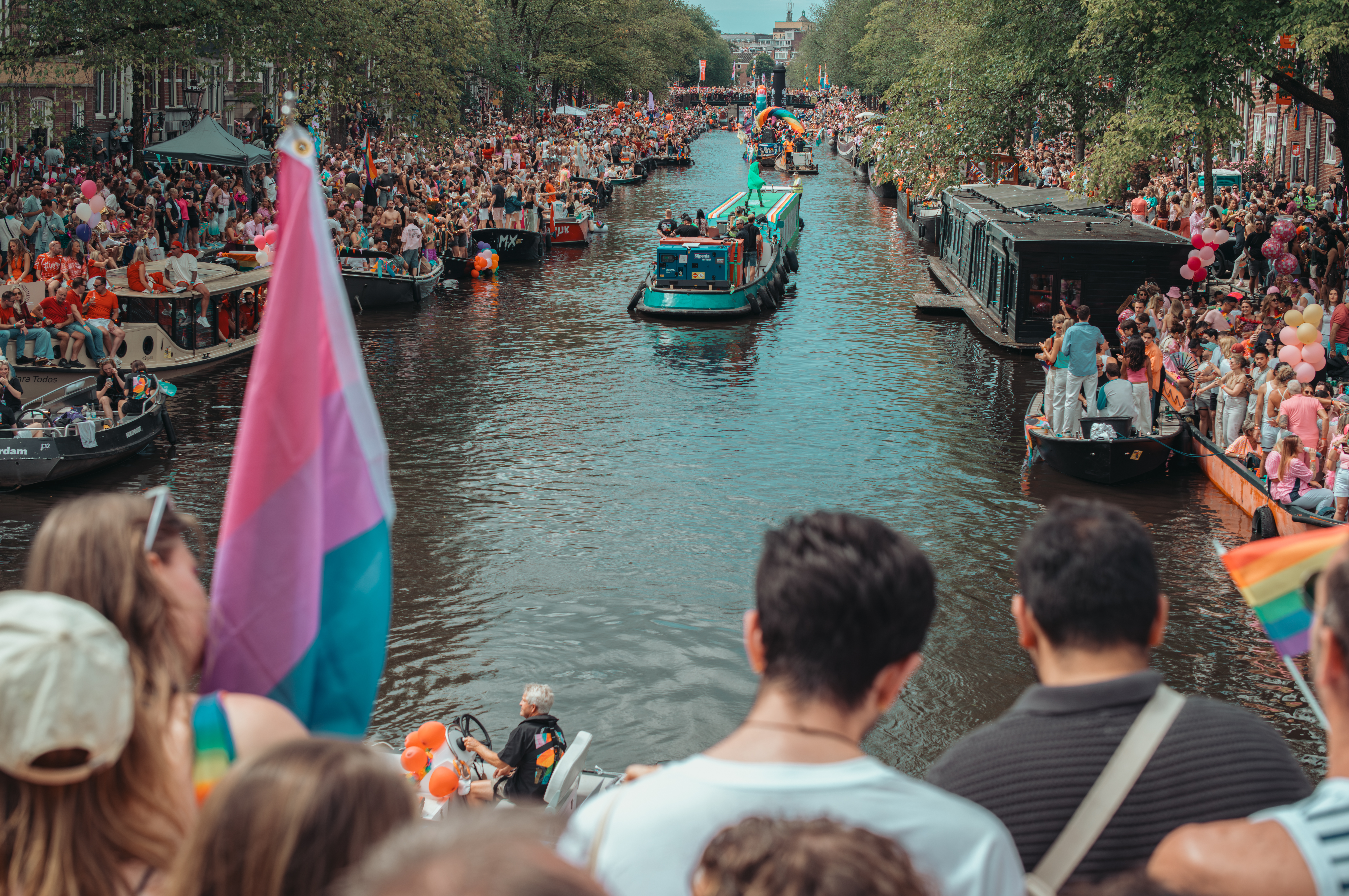 Boats and crowds fill Amsterdam's canals for the WorldPride 2026 Canal Parade.