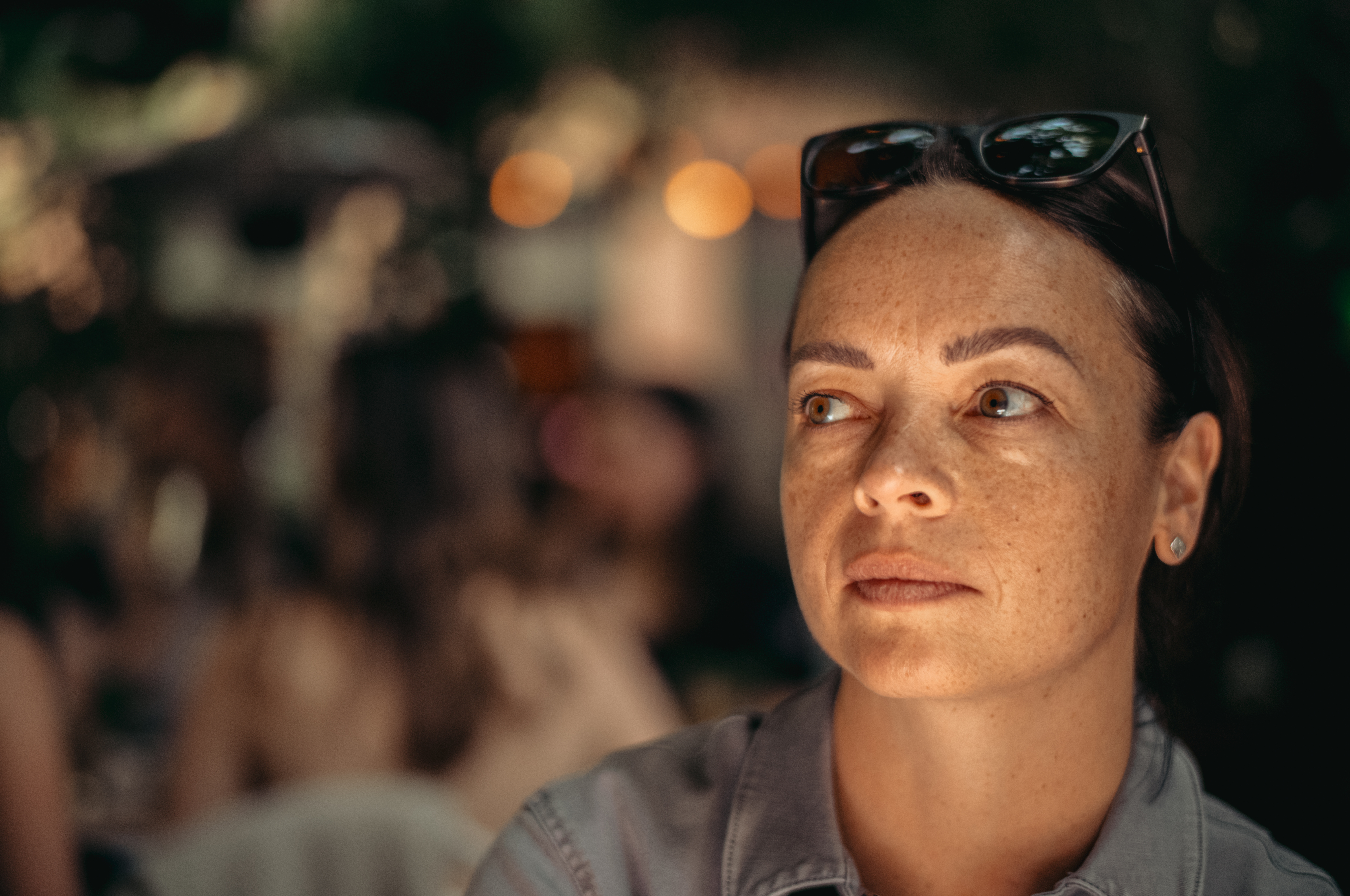 A close-up portrait of Vanessa with a warm mood.